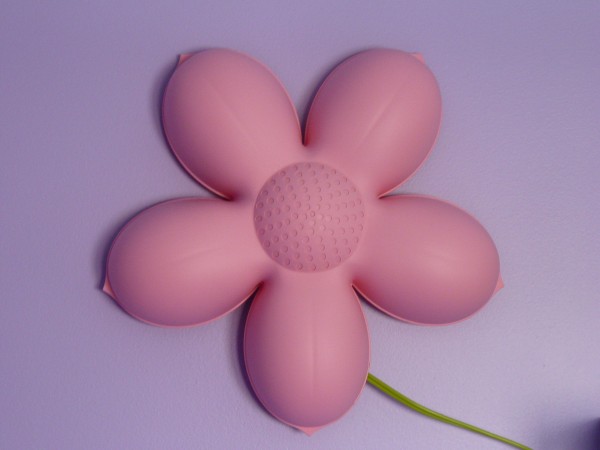 Picture of a pink Ikea flower shaped light for kids.